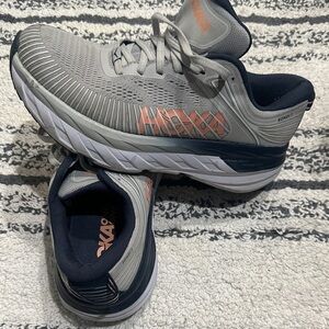 Hoka Gray and Navy Athletic Shoes with Orange Accents